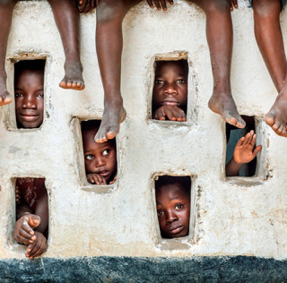 Timothy Allen - Inquisitive children in River Gee, Liberia Siena Art Photo Travel Festival 2016