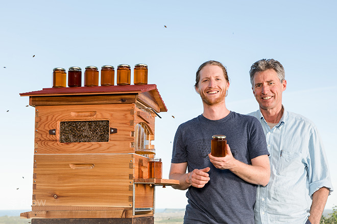 Flow Hive 2 - Cedar and Stu Anderson with a western red cedar Flow Hive in the backyard of the Bee Inventive office near Byron Bay, Australia. © BeeInventive Pty. Ltd.