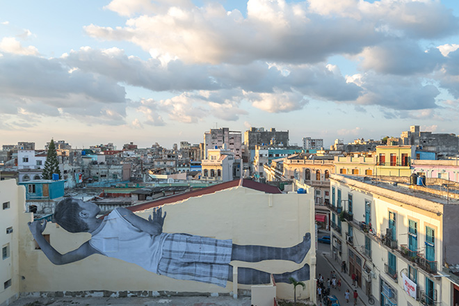 JR - GIANTS peeking at the city, Havana, Cuba, 2019. Ph. Nestor Kim. Courtesy: the artist and GALLERIA CONTINUA, San Gimignano / Beijing / Les Moulins / Habana