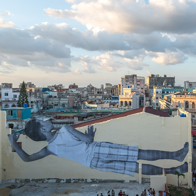 JR - GIANTS peeking at the city, Havana, Cuba, 2019. Ph. Nestor Kim. Courtesy: the artist and GALLERIA CONTINUA, San Gimignano / Beijing / Les Moulins / Habana