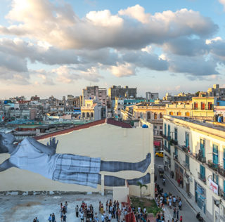 JR - GIANTS peeking at the city, Havana, Cuba, 2019. Ph. Nestor Kim. Courtesy: the artist and GALLERIA CONTINUA, San Gimignano / Beijing / Les Moulins / Habana JR – GIANTS, peeking at the city