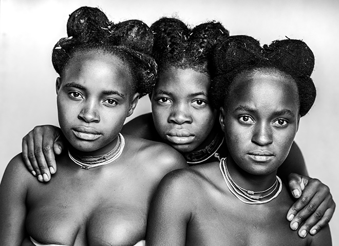 Bharat Patel (UK) - Title of the image: Mundenguelengo Sisters. Title of the series: Portraits from remote Angola. AAP Magazine #24: Portrait.