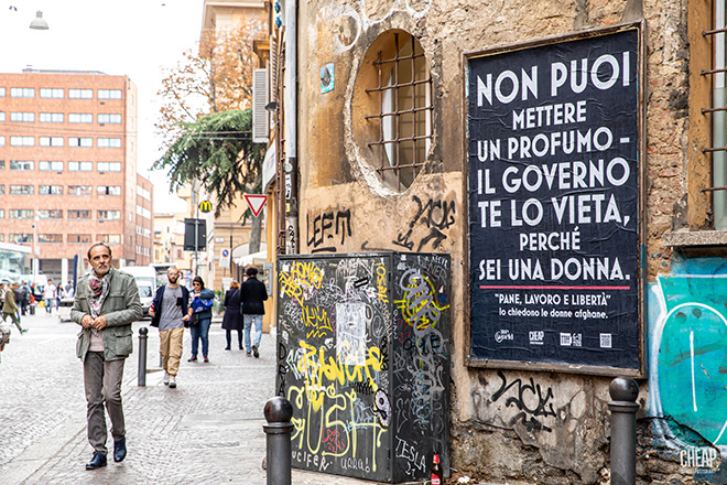 WeWorld e CHEAP Street Poster Art - Pane, lavoro e libertà, Bologna, 2022. Photo credit: Margherita Caprilli
