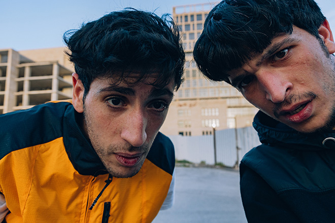 Maen Hammad - LANDING. Aram (left) and Adham (right) photographed together in the occupied West Bank city of Ramallah during a skateboard session.