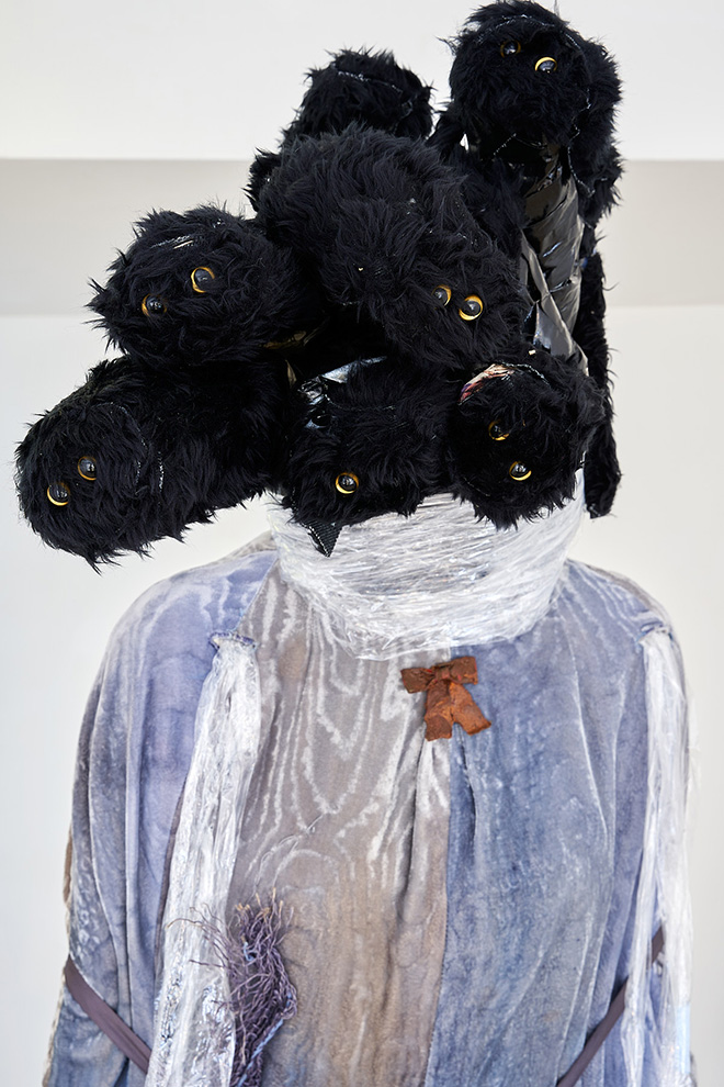 Sophie Jung - The Medusa (detail), 2019, Cat heads, fabric, glass pigs, water, rusty ladle, packing material, 190X100X90 cm. ph: Clelia Cadamuro, Broken in three places, A plus A Gallery, 2023