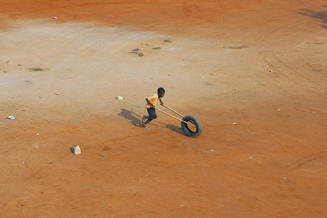 Eric Van Den Brulle - Angolan Boy with Tire, Honorable Mention, AAP magazine #37 - Travels