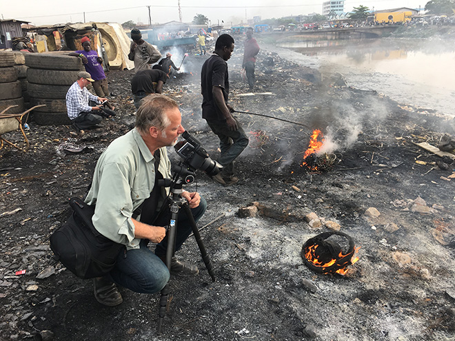 Burtynsky with Jim Panou in Agbogbloshie Recycling Yard, Accra, Ghana, 2017. Photograph by Nathan Otoo, courtesy of the Studio of Edward Burtynsky.