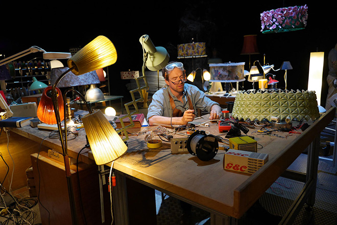 The human actor, doing some repair work in his workshop.