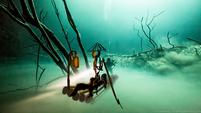 Benjamin Von Wong - Underwater River, Portrait of a Cormorant Fisherman 30m Underwater