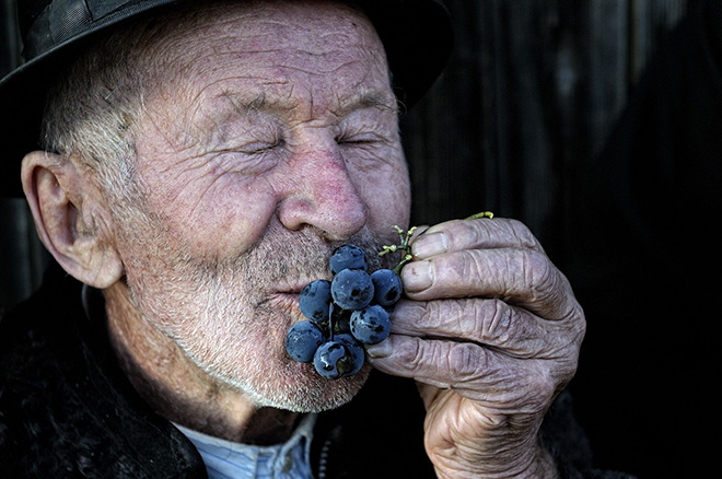 Gianluca De Bartolo - Joy of a farmer, Romania.  A romanian farmer shows is happiness after the harvest in the county of Maramures.