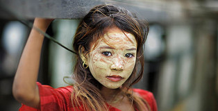 ©Timothy Allen - Bajau sea gypsy girl on her boat in Tun Sakaran, Sabah, Malaysia