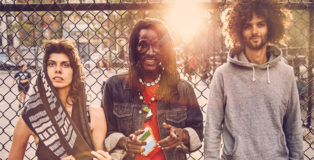 Janka Nabay and The Bubu Gang against fence. photo by Cole Evelev