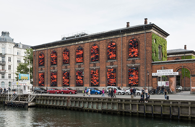 Ai Weiwei - Soleil Levant, 2017. Installation view, Kunsthal Charlottenborg, 2017. Life jackets in front of windows of facade. Courtesy of the artist. Photo by David Stjernholm.