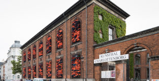 Ai Weiwei - "Soleil Levant", 2017. Installation view, Kunsthal Charlottenborg, 2017. Life jackets in front of windows of facade. Courtesy of the artist. Photo by David Stjernholm.