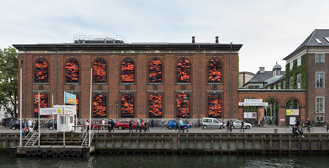 Ai Weiwei - Soleil Levant, 2017. Installation view, Kunsthal Charlottenborg, 2017. Life jackets in front of windows of facade. Courtesy of the artist. Photo by David Stjernholm.