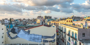 JR - GIANTS peeking at the city, Havana, Cuba, 2019. Ph. Nestor Kim. Courtesy: the artist and GALLERIA CONTINUA, San Gimignano / Beijing / Les Moulins / Habana