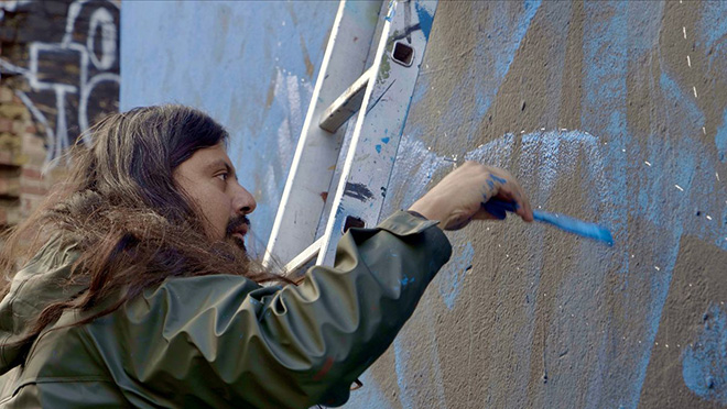 Said Dokins painting in Central London. Photo: Karoli