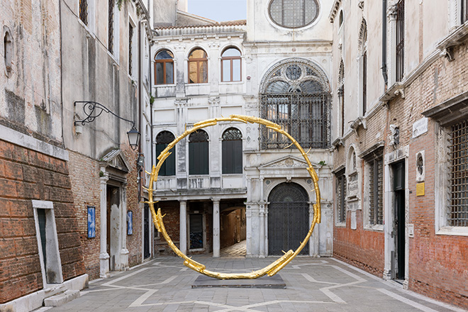 Ugo Rondinone - the sun II, 2018 Gilded bronze, 508 x 515.5 x 71 cm. Exhibition view: Ugo Rondinone, burn shine fly, Scuola Grande San Giovanni Evangelista, Venice, 2022. Courtesy the artist; Galerie Eva Presenhuber, Zurich; Esther Schipper, Berlin; Sadie Coles HQ, London; Gladstone, New York; Kamel Mennour, Paris; Kukje Gallery, Seoul. Photo © Andrea Rossetti