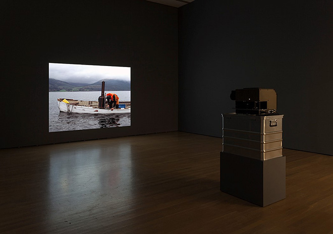 Simon Starling - Autoxylopyrocycloboros, 2006. Materials: 38 colour transparencies (6 x 7), Götschmann medium format slide projector, flight case. Dimensions/duration: Projected dimensions variable/ duration 4 mins.