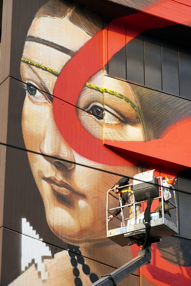 OZMO - A famous Milanese Renaissance Girl, with red brushstroke, pixels and a pointer, Milano. photo courtesy: Ozmo