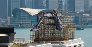 JR - GIANTS: Rising Up, Hong Kong installation. Photo credit: harbourcity.com.hk