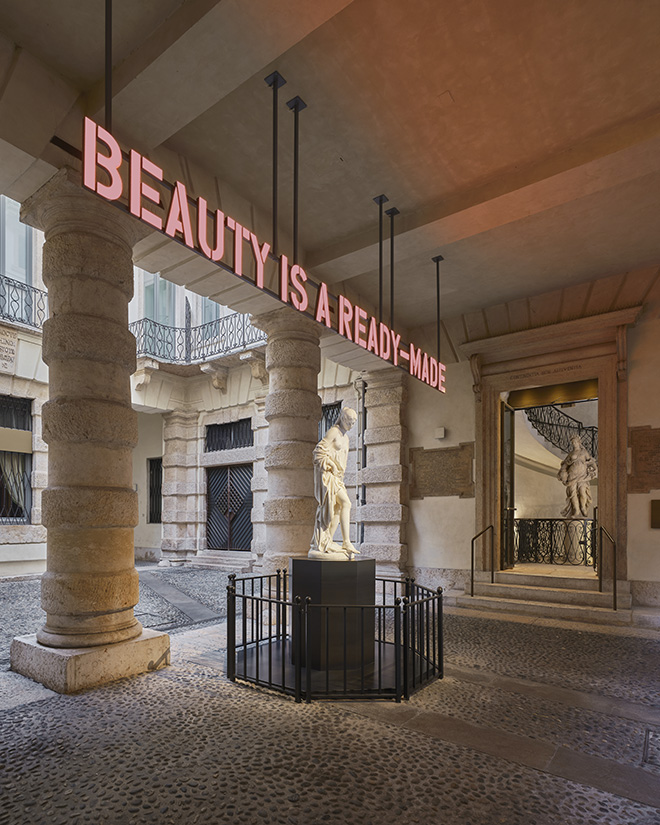 Claire Fontaine  (Collettivo - Parigi, 2004)  - Beauty is a ready made, 2024, Lettere a LED tridimensionali, struttura e supporto. Alessandro Puttinati, La Bagnante, 1846, Marmo di Carrara, Verona, Palazzo Maffei Casa Museo. Photo: Andrea Pugiotto.