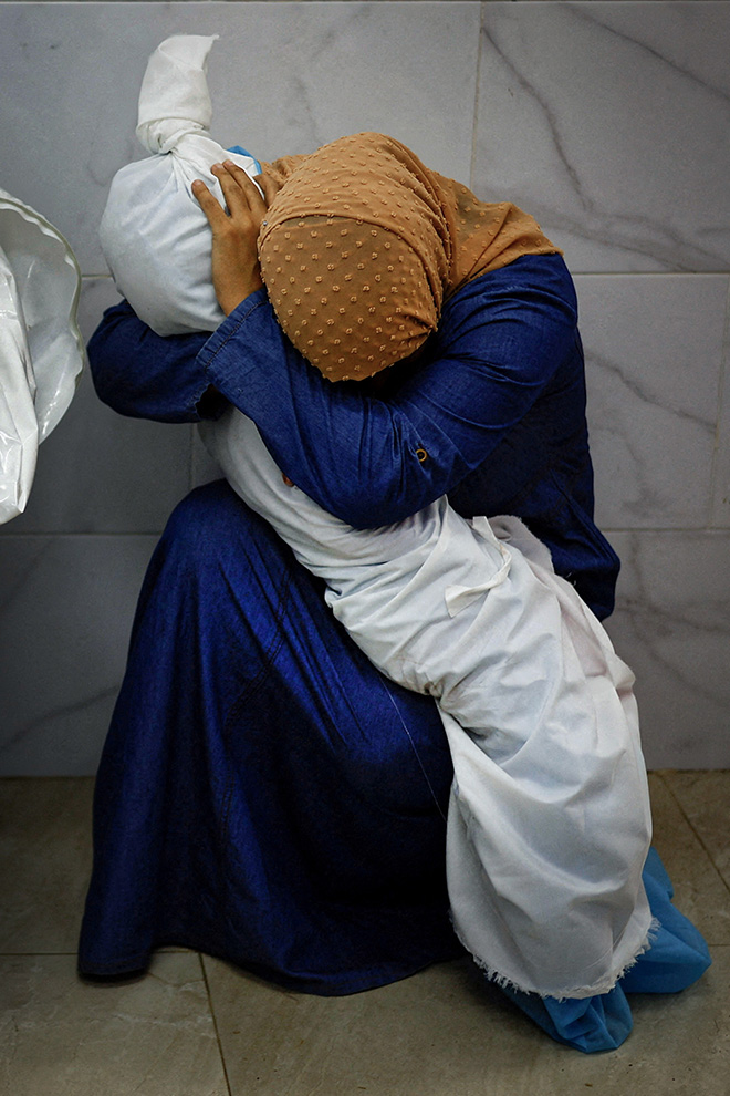 © Mohammed Salem, Palestine, Reuters – Title: A Palestinian Woman Embraces the Body of Her Niece. World Press Photo of the Year, 2024.