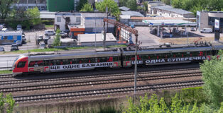 Barbara Kruger, Untitled (Another Again) 2025, Ukrainian Railways Intercity Train, Ukraine. Courtesy of the artist, RIBBON International, Ukrainian Railways, and Sprüth Magers. Photo: Vitalii Halanzha