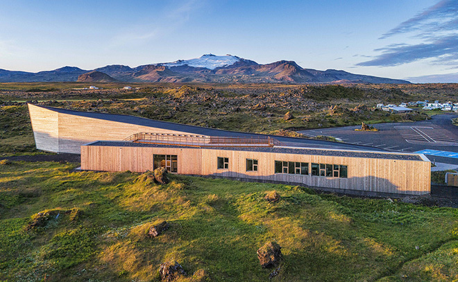 Arkis Architects - Visitor Center for Snæfellsjökull National Park. Visitor center with Snæfellsjökull in the background Photo credit: Karl Vilhjálmsson Arkis Architects - Visitor Center for Snæfellsjökull National Park. Visitor center with Snæfellsjökull in the background Photo credit: Karl Vilhjálmsson