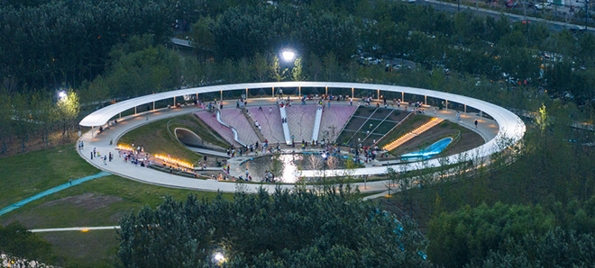 Turenscape - The Huaiyang Fuxi Cultural Park, Henan, China. Children's crater playground surrounded by flood-adaptive 'chaotic matrix' regulating stormwater up to 1.0 million cubic meters of capacity. Photo credit: Turenscape Turenscape - The Huaiyang Fuxi Cultural Park, Henan, China. Children's crater playground surrounded by flood-adaptive 'chaotic matrix' regulating stormwater up to 1.0 million cubic meters of capacity. Photo credit: Turenscape